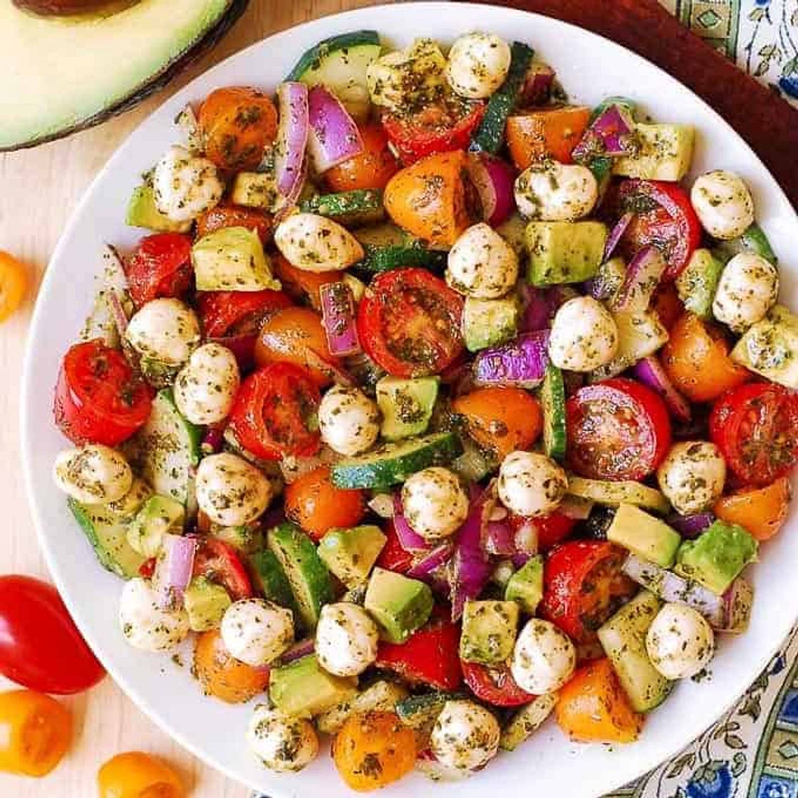 Tomato Cucumber Avocado Salad with Mozzarella and Basil Pesto