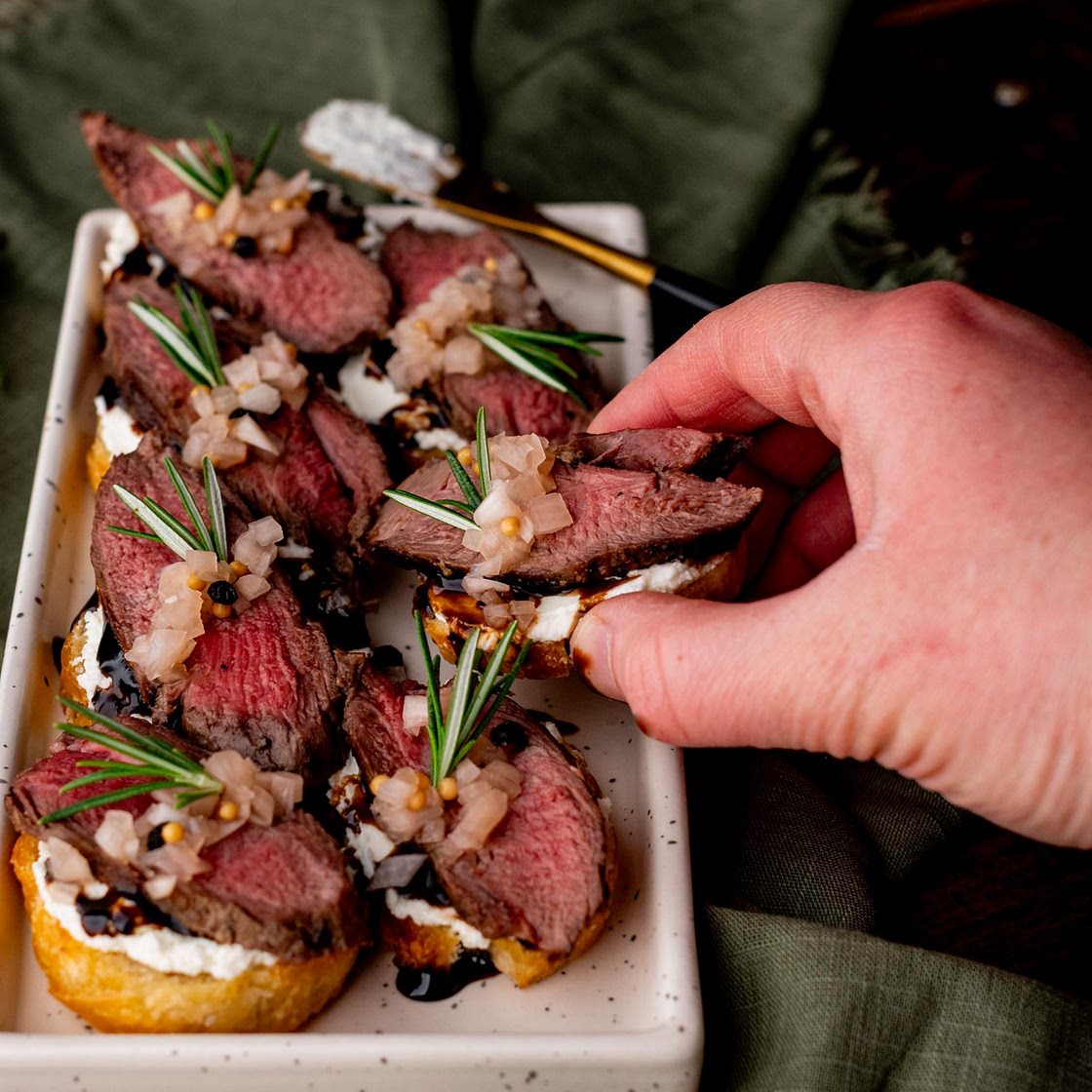 Venison Crostini with Whipped Goat Cheese & Pickled Shallots