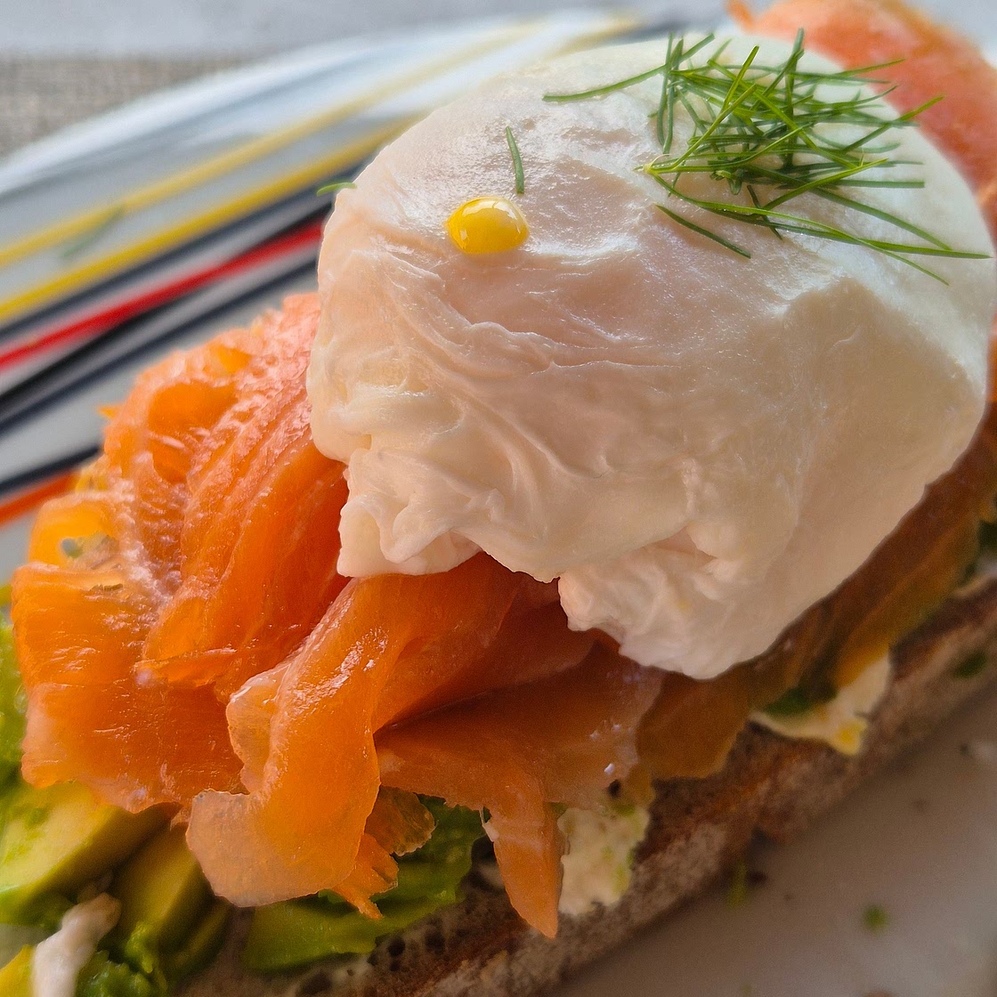 Avocado on toast with smoked salmon and poached egg