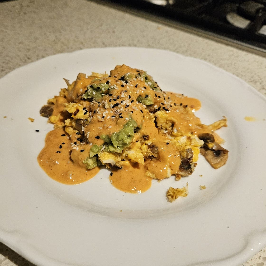 Garlic Mushroom Scramble with Smashed Avo and Spicy Peanut Drizzle