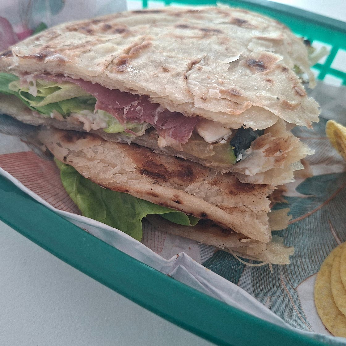 Piadina - Grilled zucchini, goat cheese and cured ham.