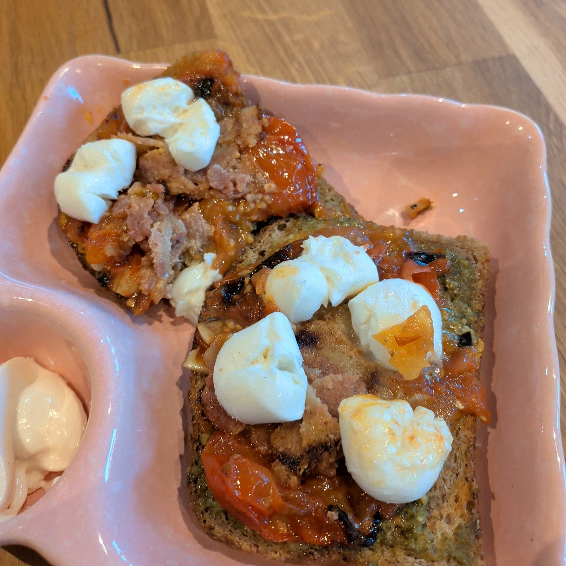 Tomato & Garlic Confit, Burrata, Pesto, Crispy Proscuitto Bruschetta