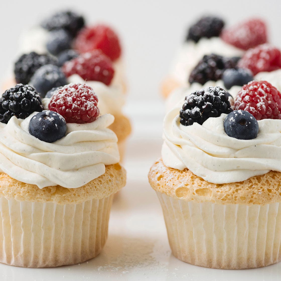 Angel Food Cupcakes with Whipped Cream and Berries
