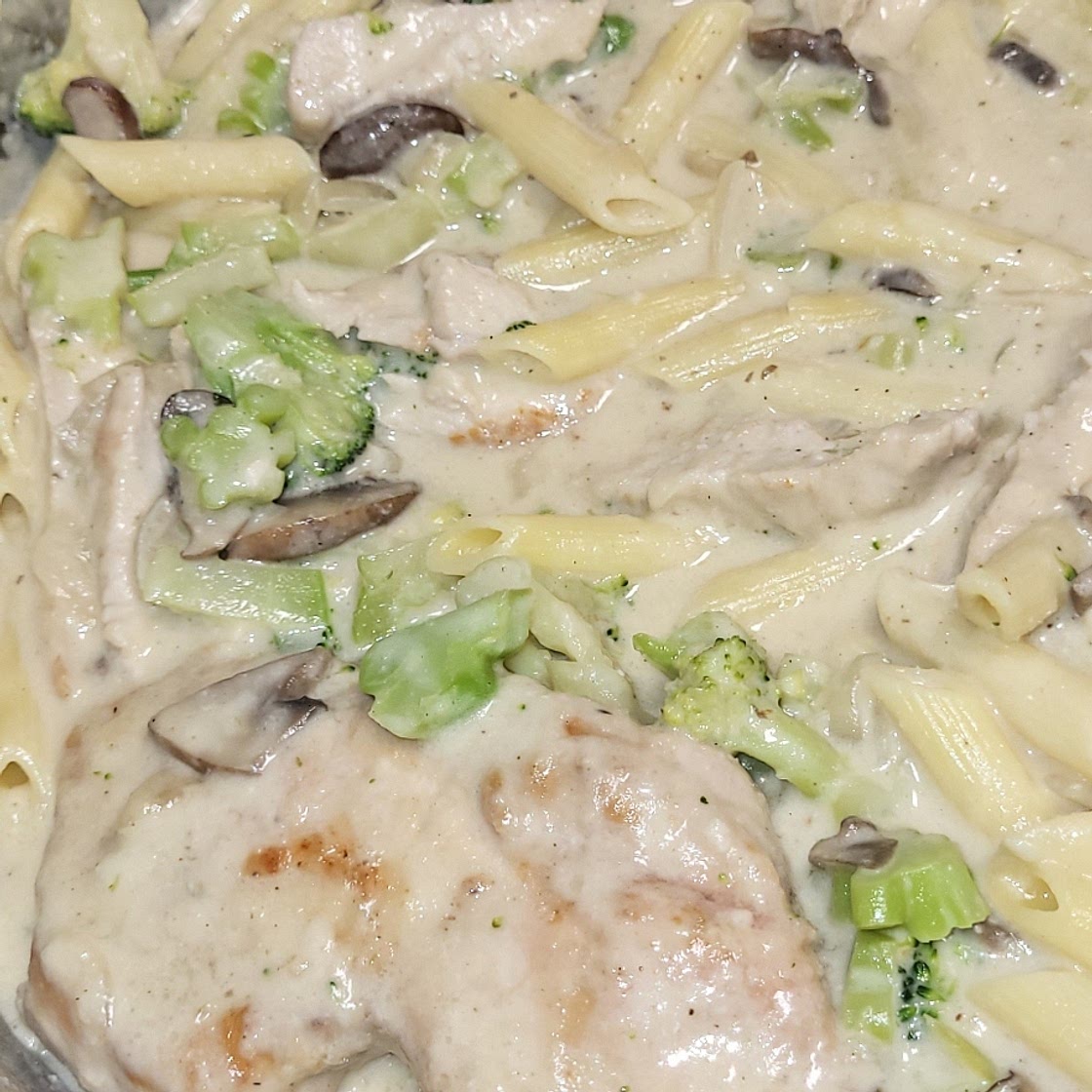 Smothered Pork Chops in Creamy Onion Gravy with Broccoli & Mushrooms