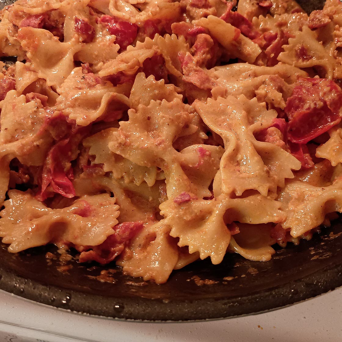 Creamy Pasta with Burst Tomatoes and Bacon Bits