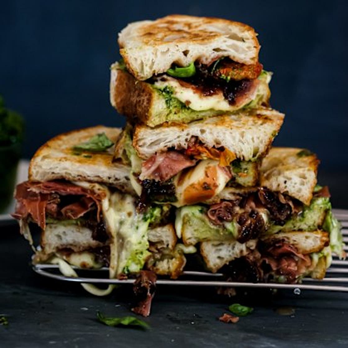 Loaded caprese toasties with pesto, onion jam and serrano ham