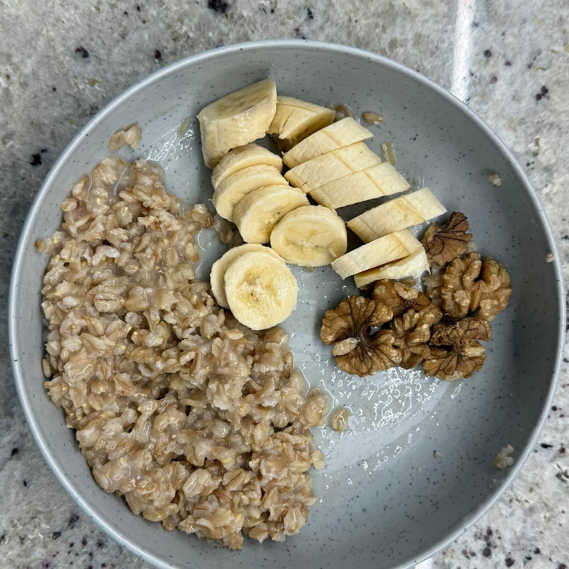 Oatmeal with honey and season berries( banana)