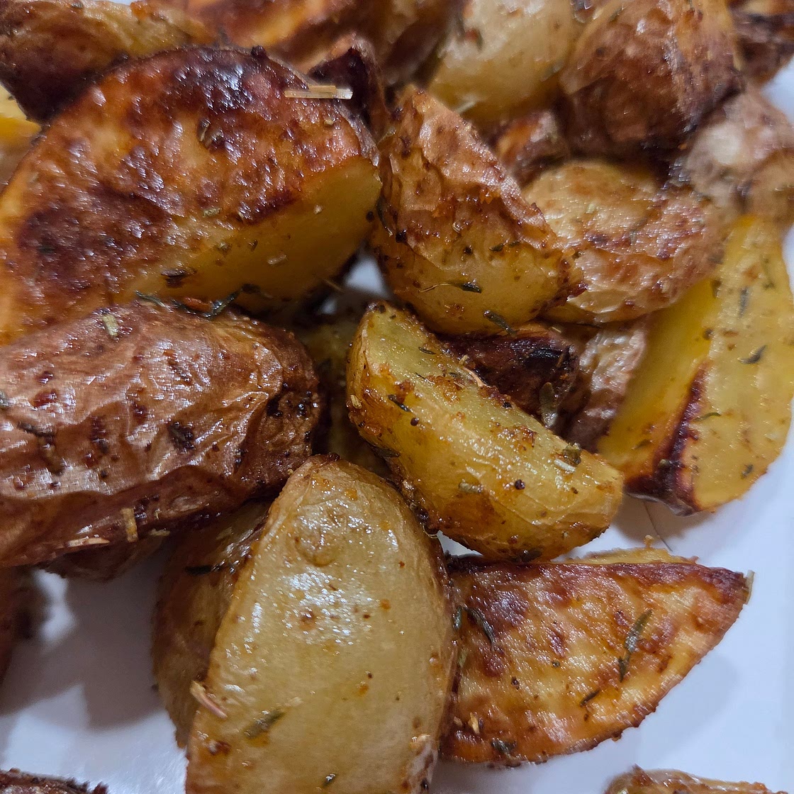 Seasoned aired fryer yellow potatoe wedges