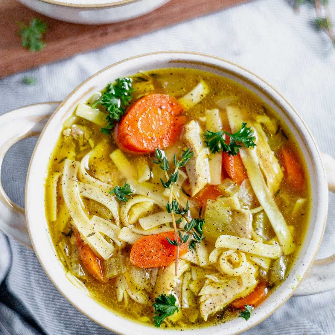 Hearty Chicken Noodle & Vegetable Soup with White Beans, Spinach and Fresh Herbs