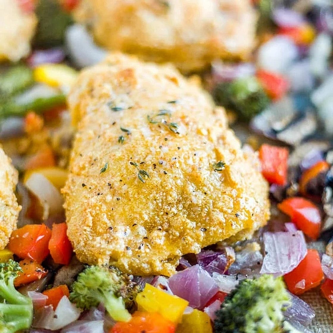 Crispy Almond-Crusted Chicken Thighs with Mediterranean Roasted Vegetables, Lemon-Herb Quinoa & Creamy Garlic Sauce