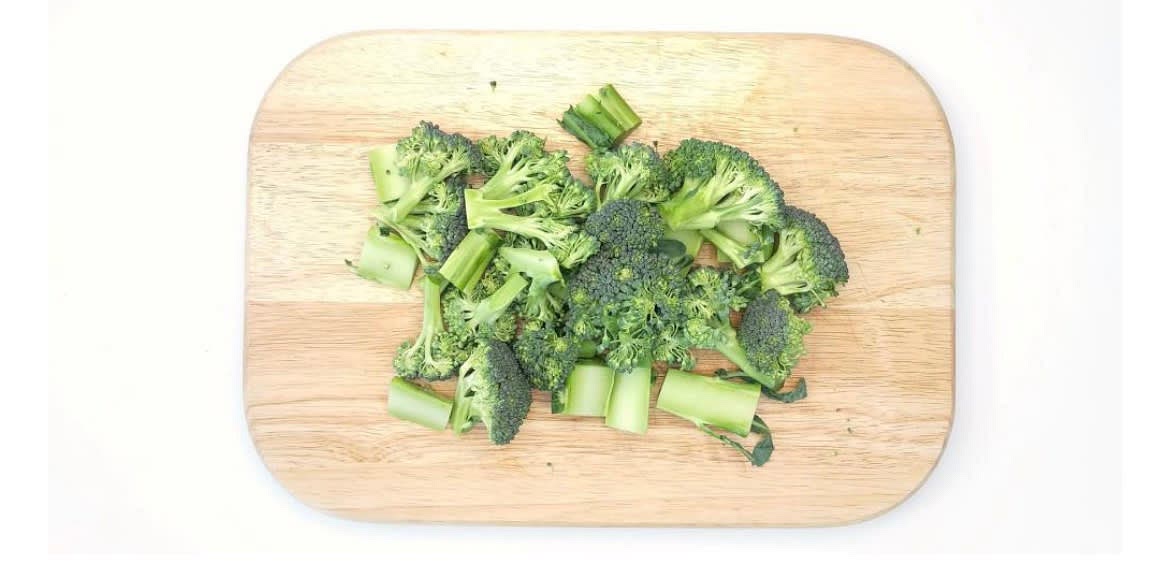 Whilst the salmon is cooking, boil a full kettle. Chop the broccoli into florets and cut the stalk[s] into bite-sized pieces. Clean and slice leek into rounds.