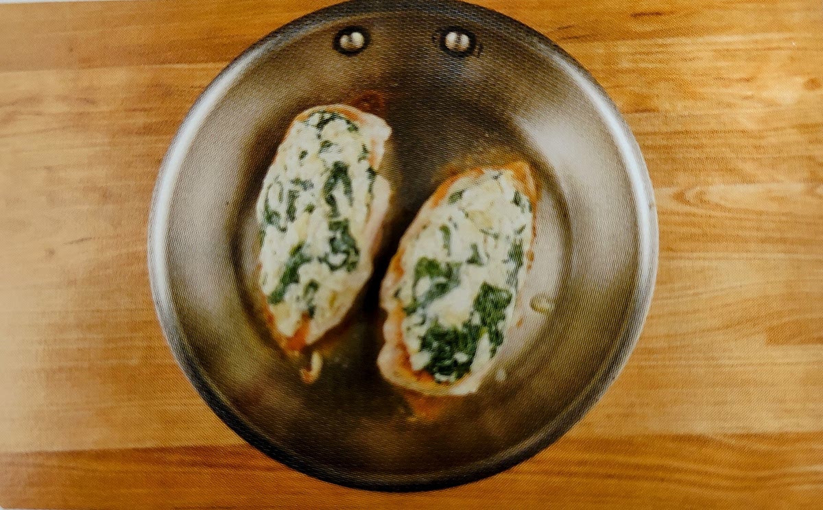 Return pan used to wilt spinach to medium-high heat. Add 1 tsp olive oil and chicken breasts to hot pan. Cook undisturbed until brown (3-4 minutes). Flip, cook undisturbed 2 minutes, and remove pan from burner