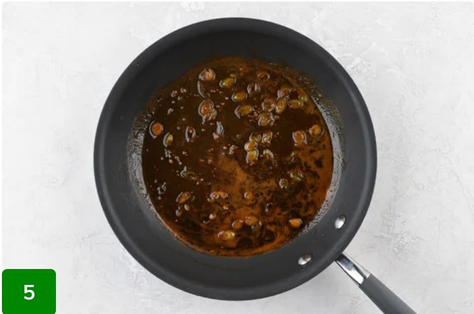 Make Sauce and Finish Dish:
Return pan used to cook steaks to medium-low heat. Add demi-glace, 2 Tbsp. water, and a pinch of salt to hot pan. Bring to a simmer. Once simmering, add garlic and herb butter. Stir constantly until melted and completely incorporated, 2-3 minutes. Remove from burner. Plate dish as pictured on front of card, topping steak with sauce and chives and garnishing orzo with cheese. Bon appétit!