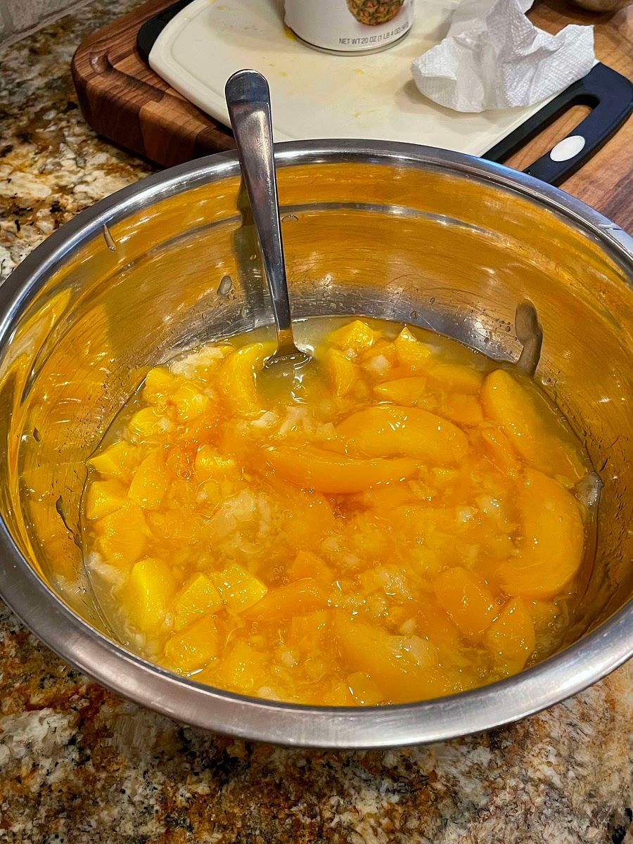 Slice peaches into bite size pieces. ** you can drain the peaches or, retain the liquid. Retaining the liquid results in a sweeter noodle pudding. Combine peaches, pie filling, and pineapples in a separate bowl.