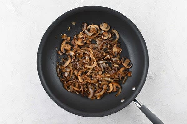 Cook the Vegetables:
Return pan used to cook shrimp to medium heat and add 2 tsp. olive oil. Add onion to hot pan and stir occasionally until browned, 8-10 minutes. Add mushrooms and cook until slightly tender, 3-5 minutes. Stir in garlic salt, garlic, and Marsala wine. Cook, 1 minute. Adding alcohol to a hot pan may cause some flames; use caution.