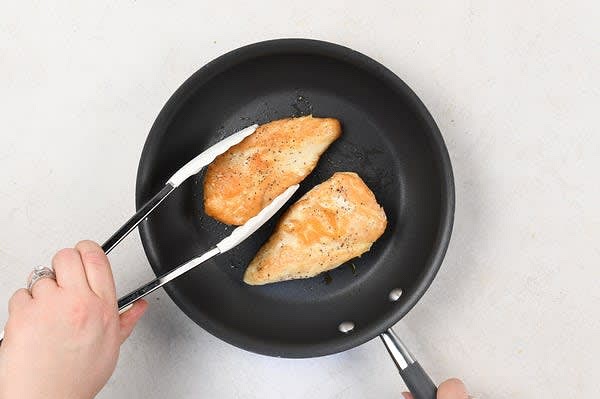 Cook the Chicken:
Pat chicken breasts dry, and season both sides with 1/4 tsp. salt and a pinch of pepper. Place a medium non-stick pan over medium heat and add 1 tsp. olive oil. Add chicken breasts to hot pan and cook until browned, 5-7 minutes on one side. Flip chicken. Cover, and cook until chicken reaches a minimum internal temperature of 165 degrees, 5-7 minutes. Remove from burner. Remove chicken to a plate and tent with foil. While chicken cooks, cook carrots.