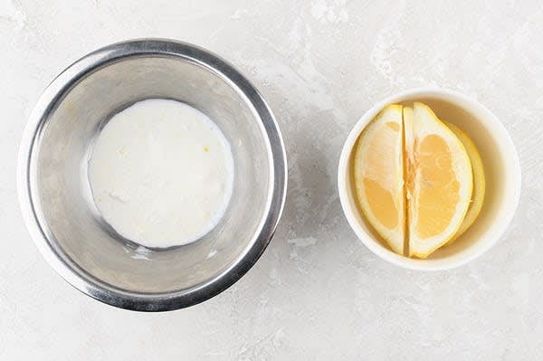 Make the Lemon Crema
Zest and halve lemon. Cut one half into wedges and juice the other half. Combine crème fraîche, 1/4 tsp. lemon zest, 2 tsp. lemon juice, and a pinch of salt and pepper in a mixing bowl. Set aside.