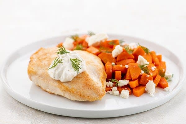 Finish the Dish
Plate dish as pictured on front of card, topping chicken with lemon crema, carrots with feta, and entire meal with dill. Squeeze lemon wedges over to taste. Bon appétit!