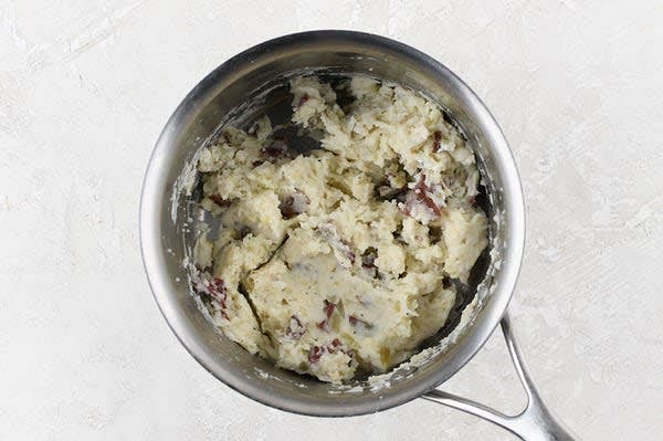 Make the Mashed Potatoes
Cut potatoes into evenly-sized chunks. Bring a medium pot with potatoes covered by water to a boil. Cook until fork-tender, 15-18 minutes. Reserve 1/4 cup potato cooking water. Drain potatoes in a colander and return to pot. Add sour cream, 2 Tbsp. potato cooking water, 1/4 tsp. salt, and a pinch of pepper. Mash until smooth. If too thick, add additional potato cooking water, 1 Tbsp. at a time, until desired consistency is reached. Stir in Parmesan. Cover and set aside. While potatoes cook, prepare chicken.