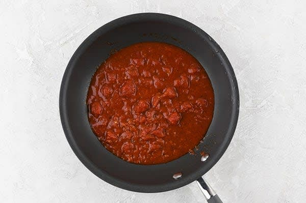 Make Sauce and Finish Dish
Return pan used to cook chicken to medium-low heat. Add marinara, remaining red pepper pesto, and 2 Tbsp. water. Bring to a low simmer. Simmer, 2 minutes. Remove from burner. Plate dish as picture on front of card, topping chicken with sauce. Bon appétit!