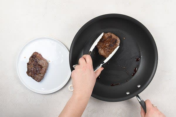 Cook Steak and Finish Dish
Place a medium non-stick pan over medium heat and add 2 tsp. olive oil. Add steaks to hot pan and cook until steak reaches desired doneness, or 4-6 minutes per side for medium/medium-well. Steak thickness can vary; if you receive a thinner steak, we recommend checking for doneness sooner. Remove from burner. Rest, 3 minutes. Remove tomatoes and feta from marinade (reserve leftover marinade for plating). Plate dish as pictured on front of card, topping steak with tzatziki and potatoes with tomato relish. Top potatoes and tomatoes with reserved marinade, if desired. Bon appétit!