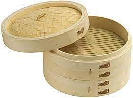 Place the ang ku kueh in a bamboo basket and then place the basket into the steamer. Take note that the bamboo basket is a necessary tool to be used if you want balanced steaming. [9 December 2021: I didn't use the bamboo basket - I think it's fine to just steam it using the wok and stand.]