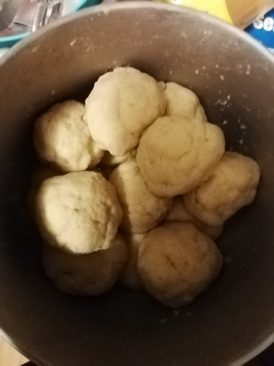 Split dough into 7 even balls. Roll dough out on to a floured surface until roughly ¼ inch thick or thinner. Gently place your dough square/circle on to a baking sheet. If you have two baking sheets, you can bake two layers at once, cutting down your cooking time.
I like to put the dough on the cookiesheet and roll it there to get the thinnest I can.