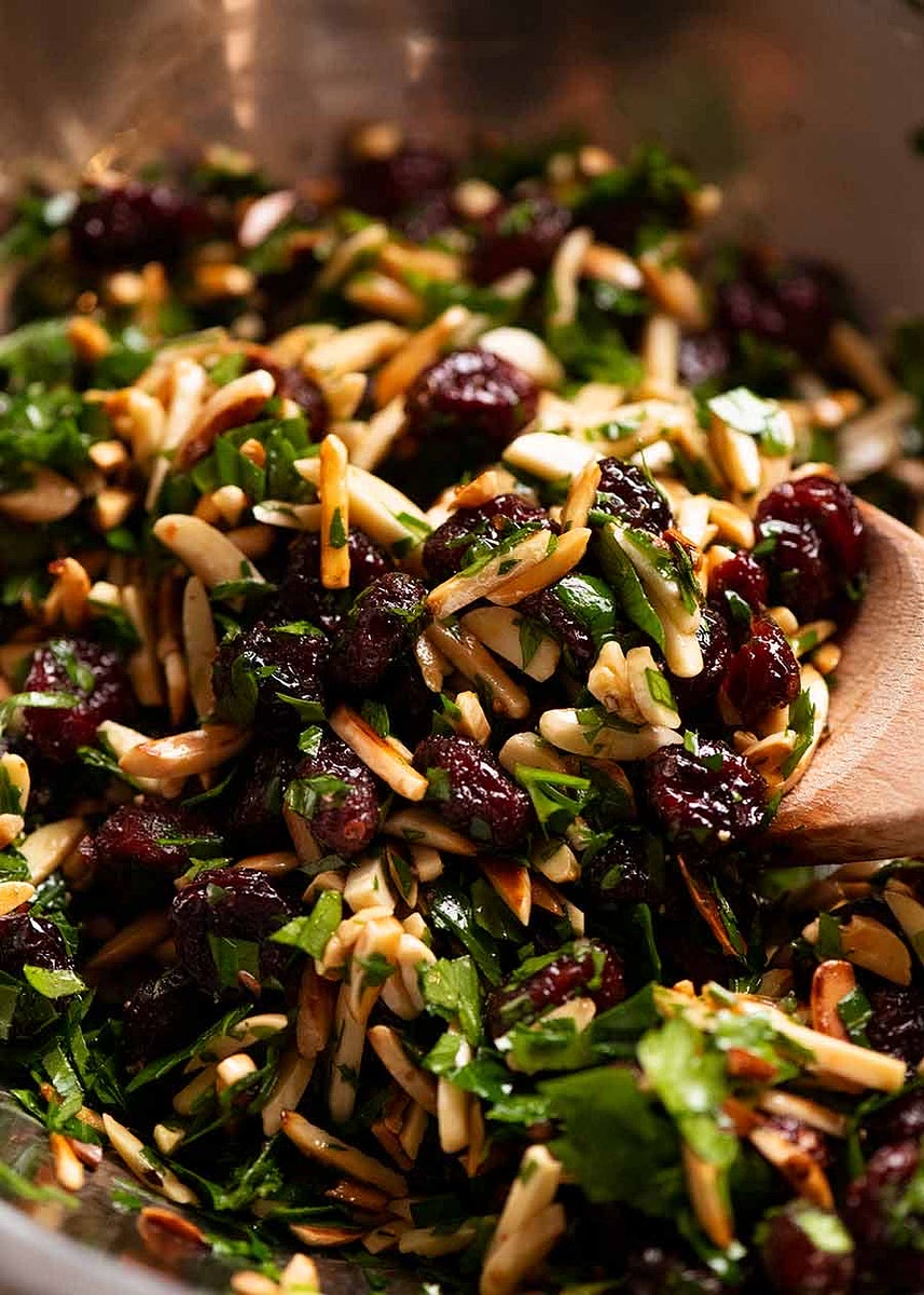 Pomegranate – This is what we use to sprinkle across the finished dish for their jewel-like festive colour, and of course for great pops of tart juiciness! Dried cranberries – In the spirit of holidays and also for the tart/sweet profile rather than just plain sweetness that other dried fruits have. Alternatives (in order of suggestion): Dried sour cherries, golden raisins, normal raisins or sultanas; Orange juice – This is used to soak the cranberries in order to reconstitute them and plump them up. Otherwise, they’re rather shrivelled and chewy. Because this is, after all, for a special occasion why not one more step to make the cranberries extra special! As mentioned, it’s mainly for the cranberries, but the orange juice also adds a touch of extra sweetness and citrusy flavour – very on-theme for holidays! Substitute with any fruit juice you wish. Apple would especially be great – otherwise just use water with a dollop of honey or maple syrup; Slivered almonds – Purchased already cut into slivers (else sliver blanched almonds yourself), this is a lovely shape that you can use as-is. We also give them a quick toasting to boost the nuttiness and bronze them. Alternatives: Almonds (preferably blanched), pistachios, hazelnuts, pecans, macadamias, walnuts; Parsley for freshness and the green colour for Christmas! Olive oil to add just a bit of richness and bring it all together. Make ahead option: Make the Tapenade up to 2 days ahead but leave the almonds out until just before serving. Almonds can be toasted ahead, just store them in the pantry until required.