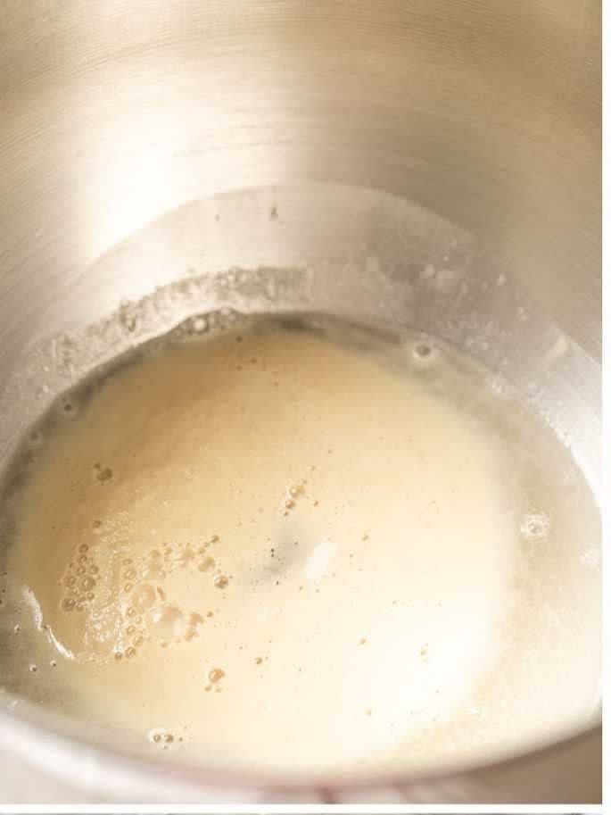 Gently whisk together the instant yeast, sugar, and half of the lukewarm water. Cover with a dish towel and let sit for 5-10 minutes until foamy (if using active dry yeast, let sit for 15 minutes).