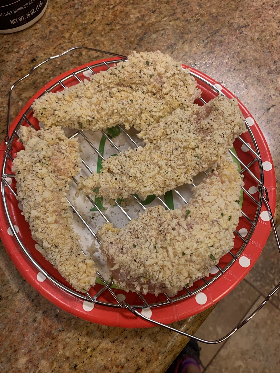 Working one at a time, dip chicken into flour, then eggs, and then panko mixture, pressing to coat.