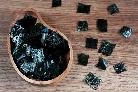 Cut the nori sheets with scissors into bite size squares.