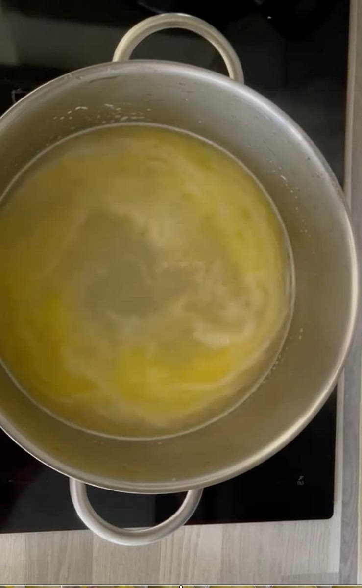 Add water, vanilla sugar, salt and the melted butter to a pot and bring to boil.