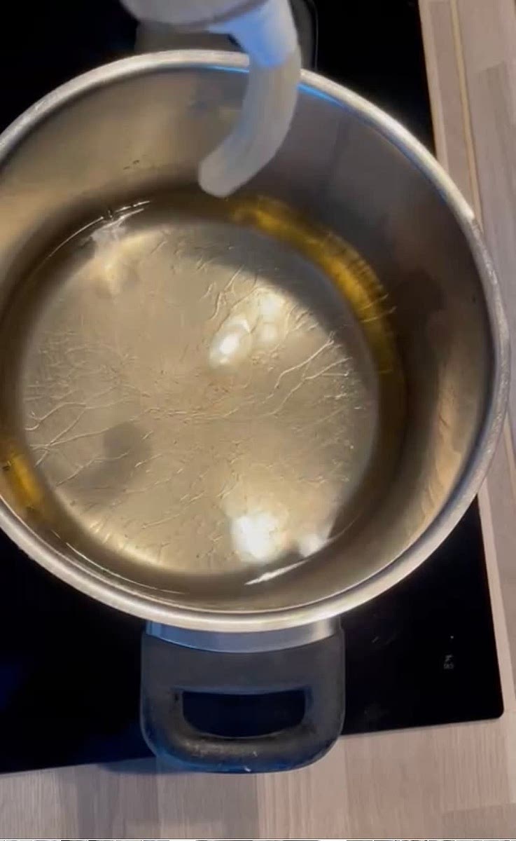 Transfer to a piping bag fitted with a rounded star tip and carefully pipe the mixture into the oil.