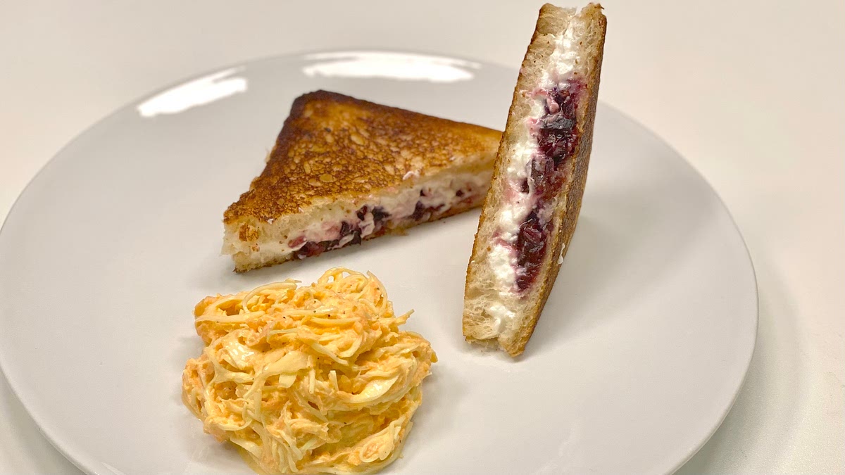 Cut the cooked sandwiches in half. Divide between 2 dishes.
Serve with the salad on the side. Enjoy!