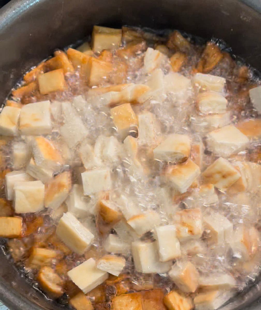 Heat up vegetable oil in small pot until hot