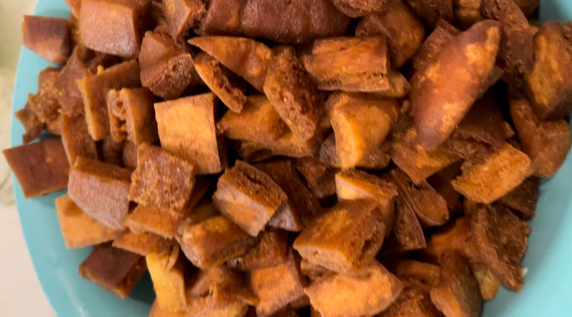 Slowly add in pita squares until golden brown