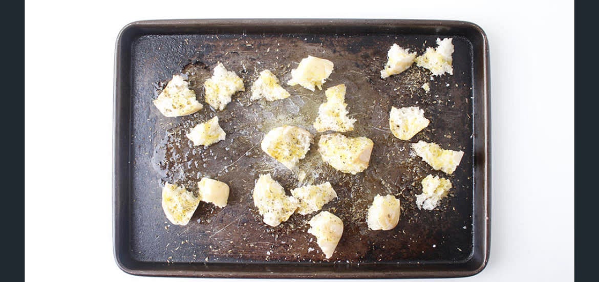 Meanwhile, rip the ciabattas] into large, bite-sized pieces and add them to a baking tray Drizzle them very generously with olive oil and season with a generous pinch of salt and pepper Sprinkle over half the dried oregano Put the tray in the oven for 10-12 min or until golden and crispy - these are your herby croutons
