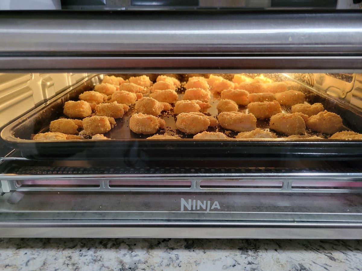 Coat shrimp in a mixture of egg and milk, then toss in Almond flour. Airfry till crispy. Mix with the Sauce. Add green onion. Serve immediately.