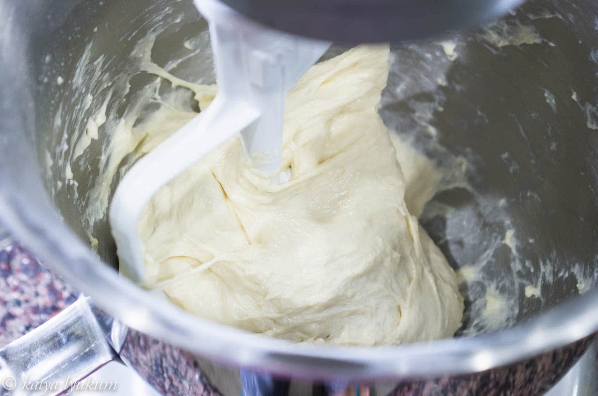 Mix all ingredients for the dough except oil. Knead it long enough to form gluten. A stand mixer with a flat beater is the best for this job. Finish kneading by shaping it into a ball.