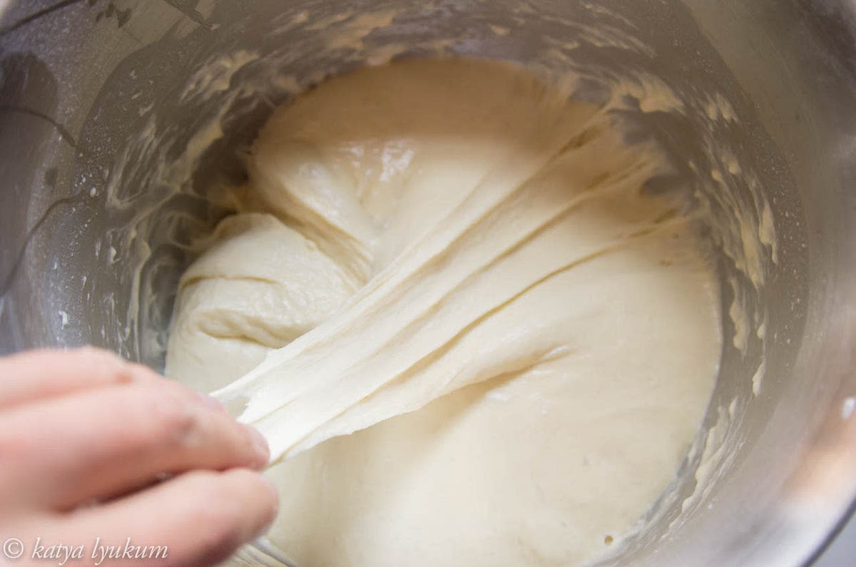 Give it 1-1.5 hours (depending on room temperature) to rise. Its volume should double. Divide the dough into portions, shape each portion into a ball, place in an oiled container, and cover. At this point, the dough can be refrigerated in a closed container for later baking. It will keep for up to 4 days. If you are ready to bake the same day, keep the dough at room temperature until the oven is hot.