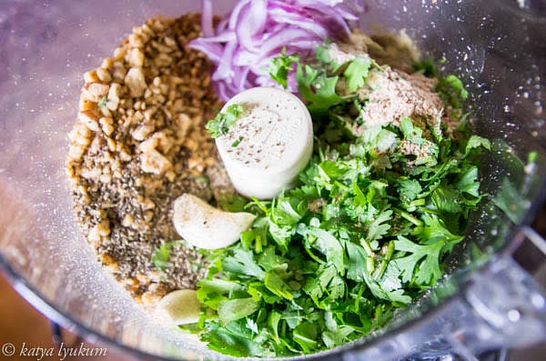 Process toasted walnuts, onions, cilantro, garlic, spices, and dry herbs to a pesto-like consistency.