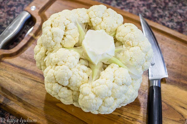 Place cauliflower stem up. Remove all the leaves.