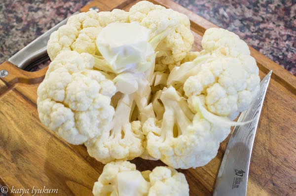 Make vertical cuts around the stem, separating larger florets.