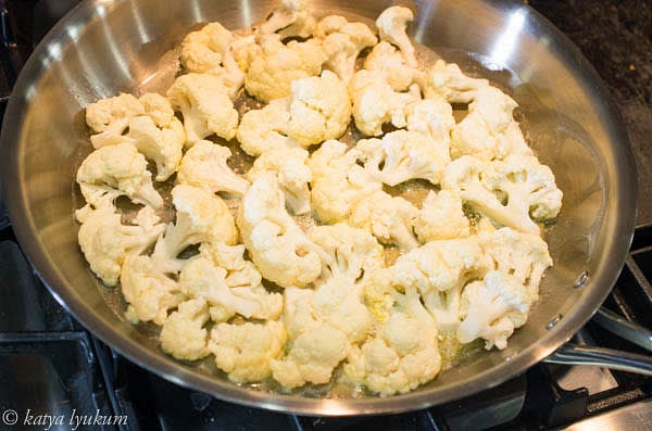 Place butter on a cold skillet and melt it on medium heat. Place cauliflower florets flat side down, in one layer, sprinkle with salt and cook until golden brown for about 10-15 minutes.