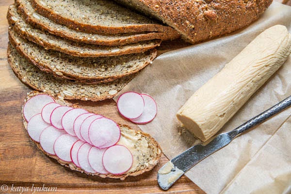 Spread a thin layer of miso butter on sliced bread. Place coins of radishes and cucumbers on top. Make sandwiches. Keep refrigerated or in a cooler till ready to eat.