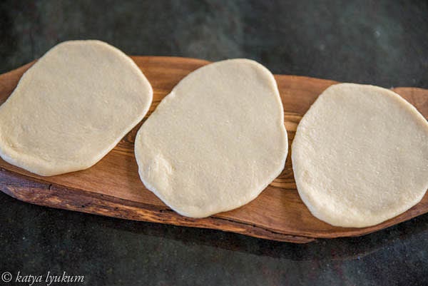 Roll three portions of dough into ovals 1/4" thick.