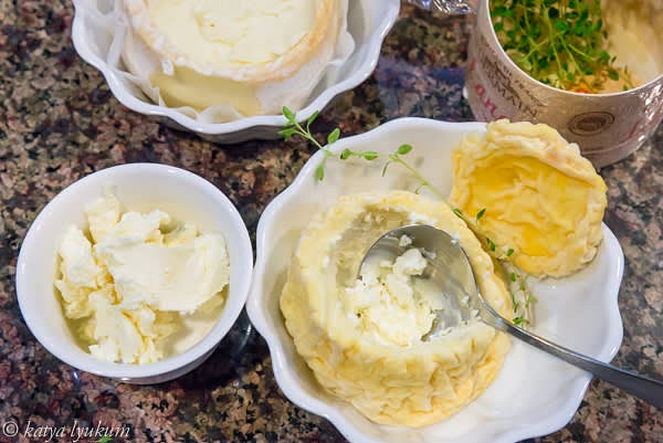 Carefully cut off the top of the cheese using a sharp utility knife. Scoop the center to make a cavity. Lick your fingers. Take pictures.