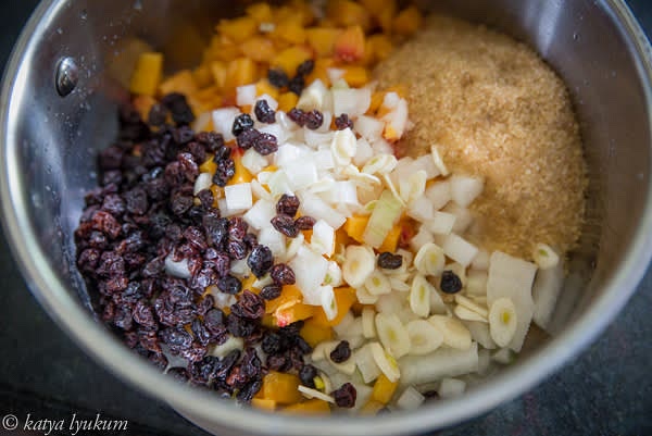In a sauce pan, mix all ingredients but spices and leave for an hour to draw juices, covered.