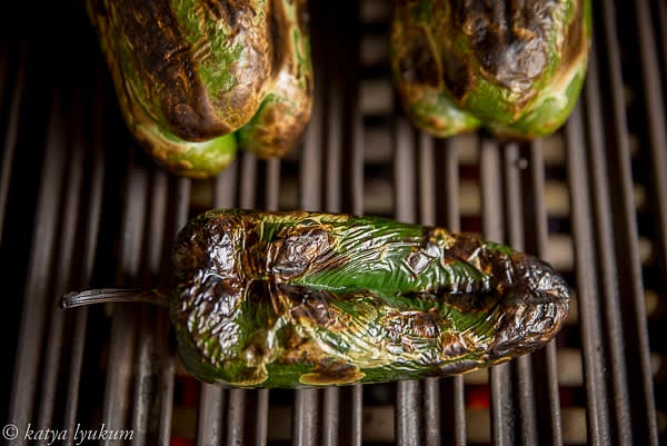 Charr and peel poblano peppers.