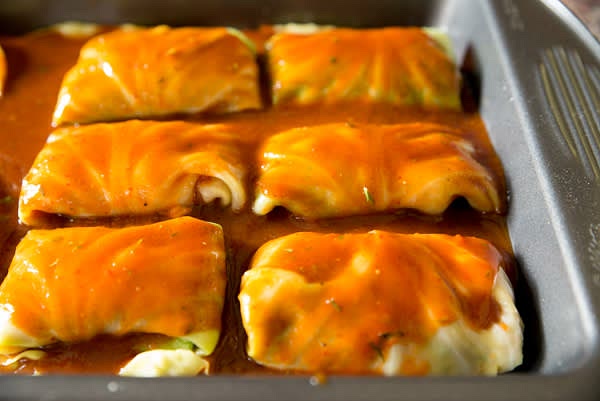 Poor the rest of the sauce on top and cover with the rest of small cabbage leaves or foil.